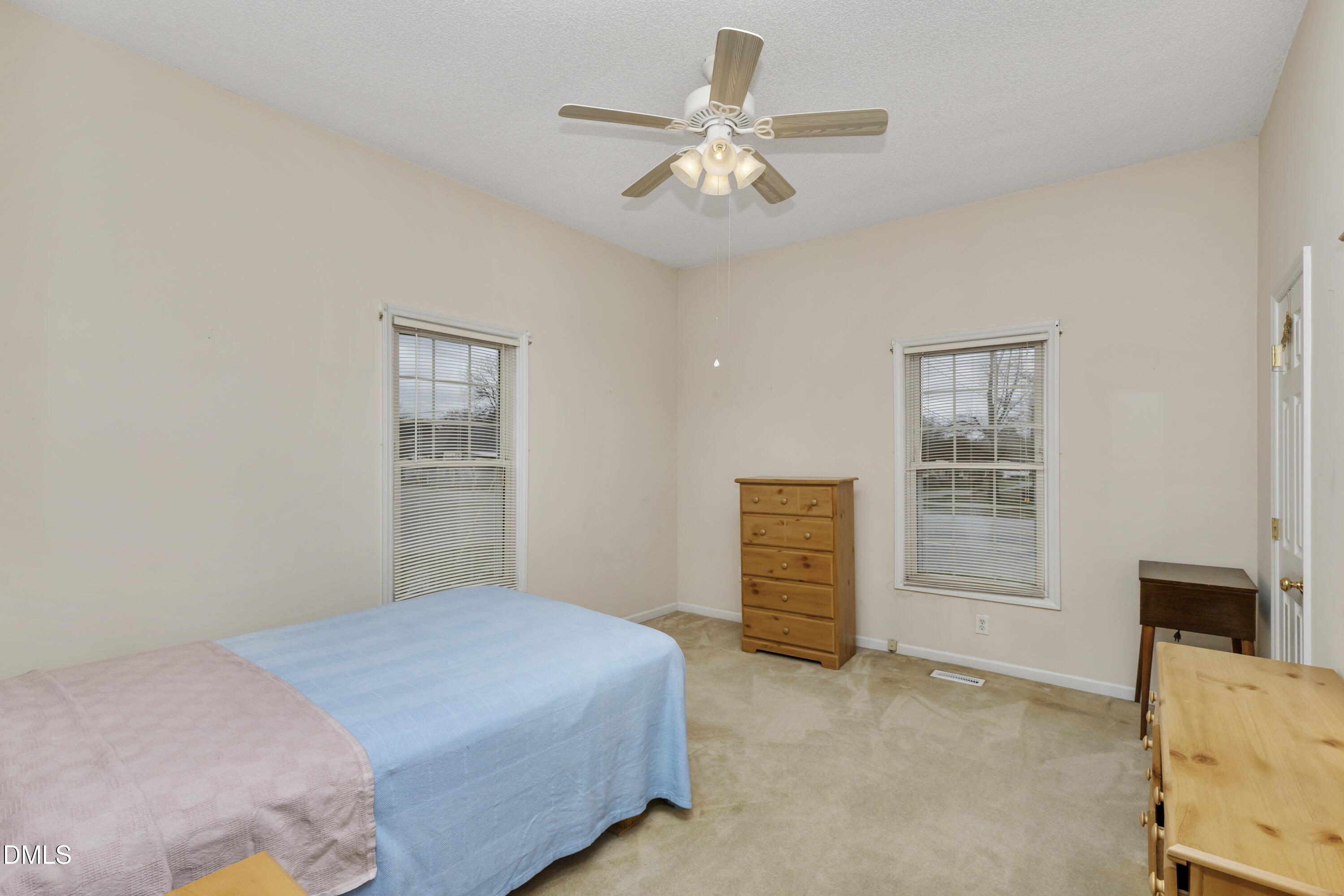 100 East E Street Erwin, NC 28339 - Photo 10 of 27 a bedroom with a bed dresser and a window