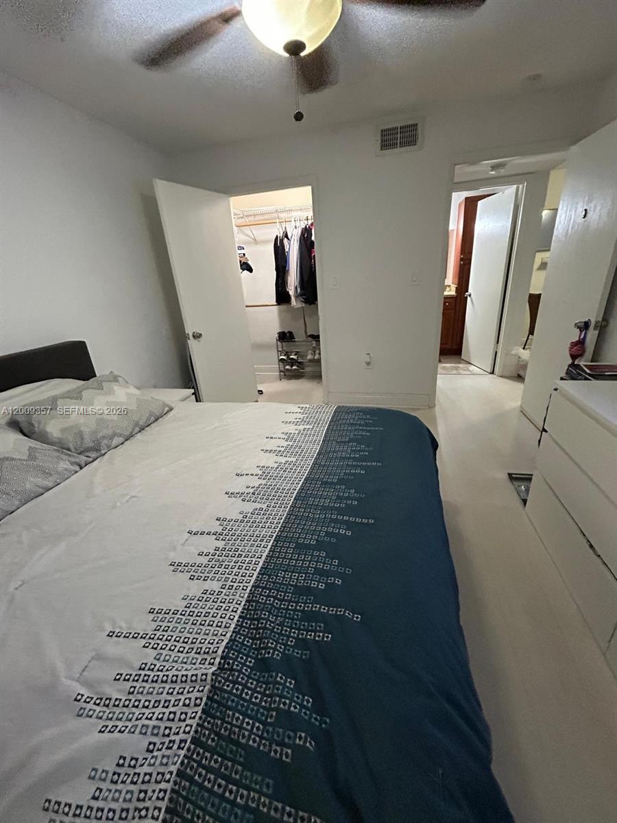 15551 Southwest 104th Terrace, Unit 814 Miami, FL 33196 - Photo 14 of 30 a living room with bed