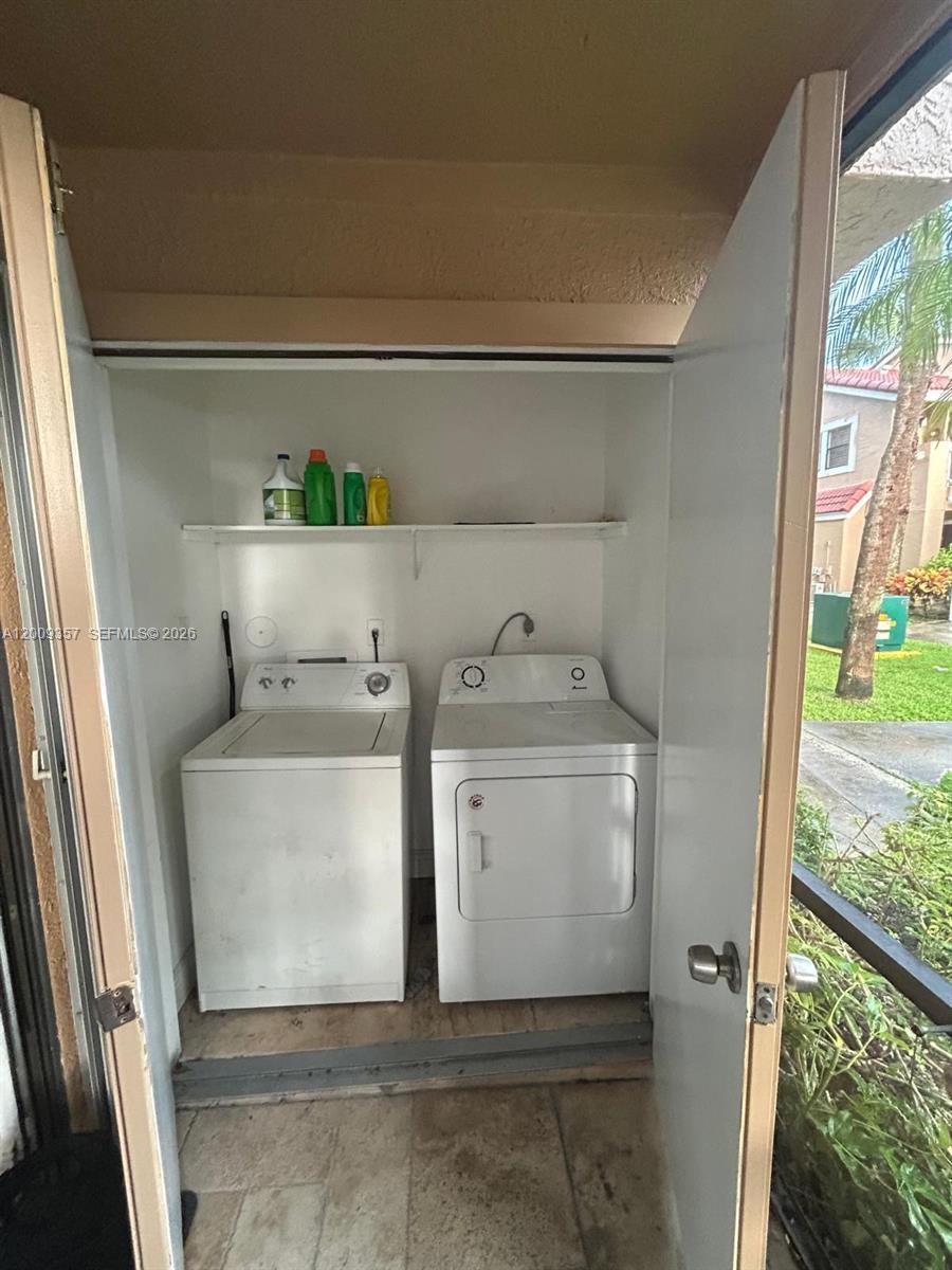 15551 Southwest 104th Terrace, Unit 814 Miami, FL 33196 - Photo 23 of 30 a utility room with dryer and washer
