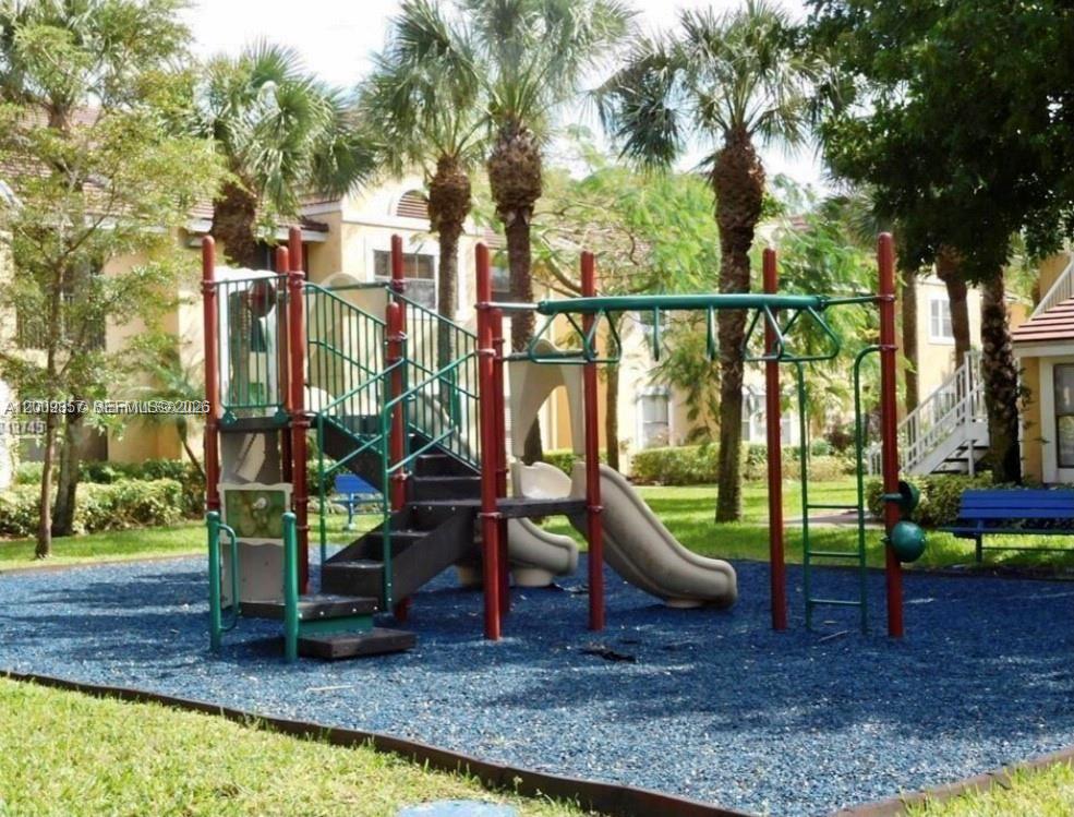 15551 Southwest 104th Terrace, Unit 814 Miami, FL 33196 - Photo 27 of 30 a view of outdoor space with seating area and trees around