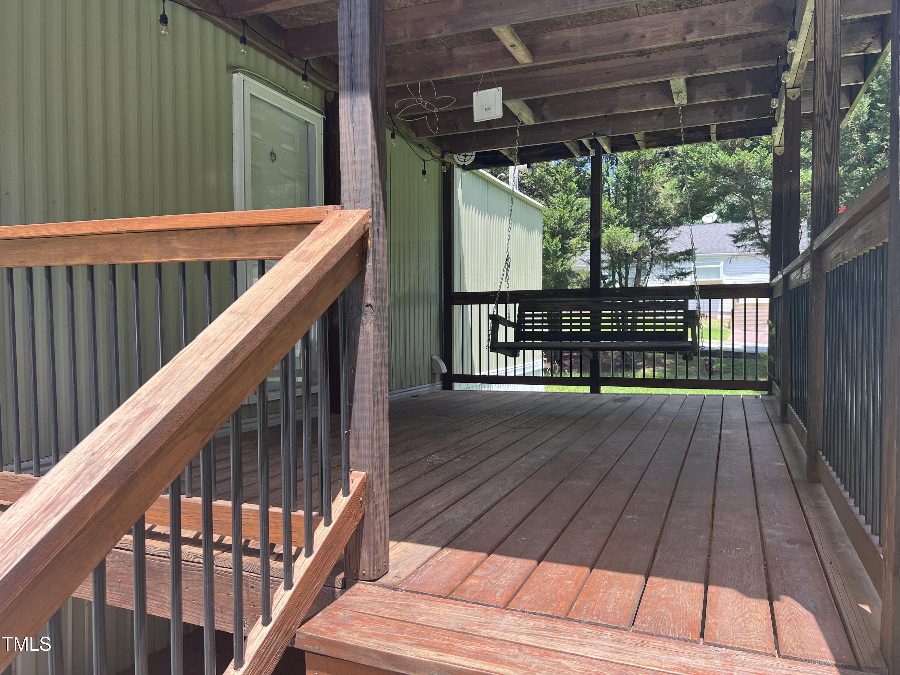 2432 Redwood Road Durham, NC 27704 - Photo 4 of 13 a view of balcony with wooden floor