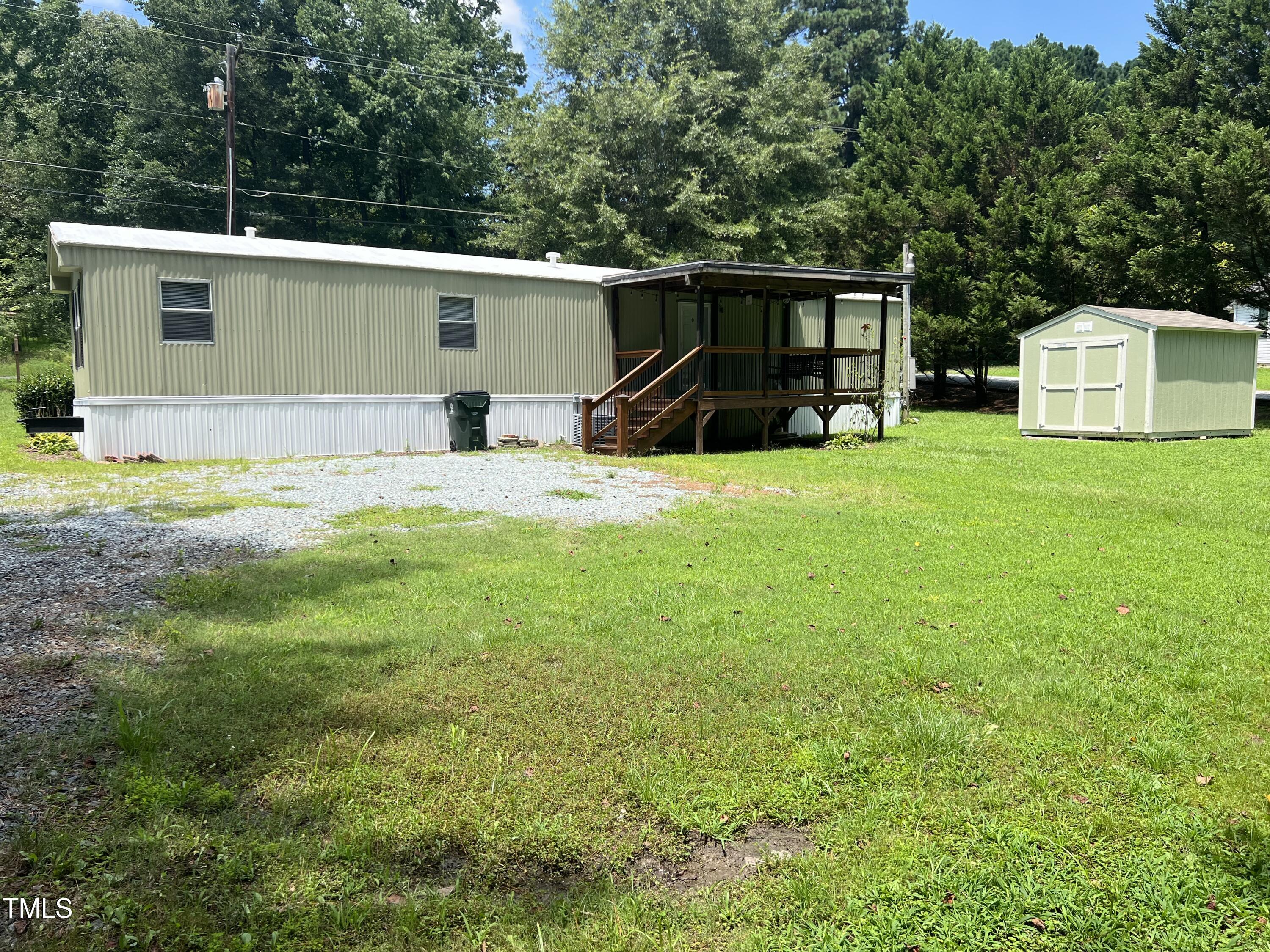 2432 Redwood Road Durham, NC 27704 - Photo 5 of 13 a view of a house with backyard and trees