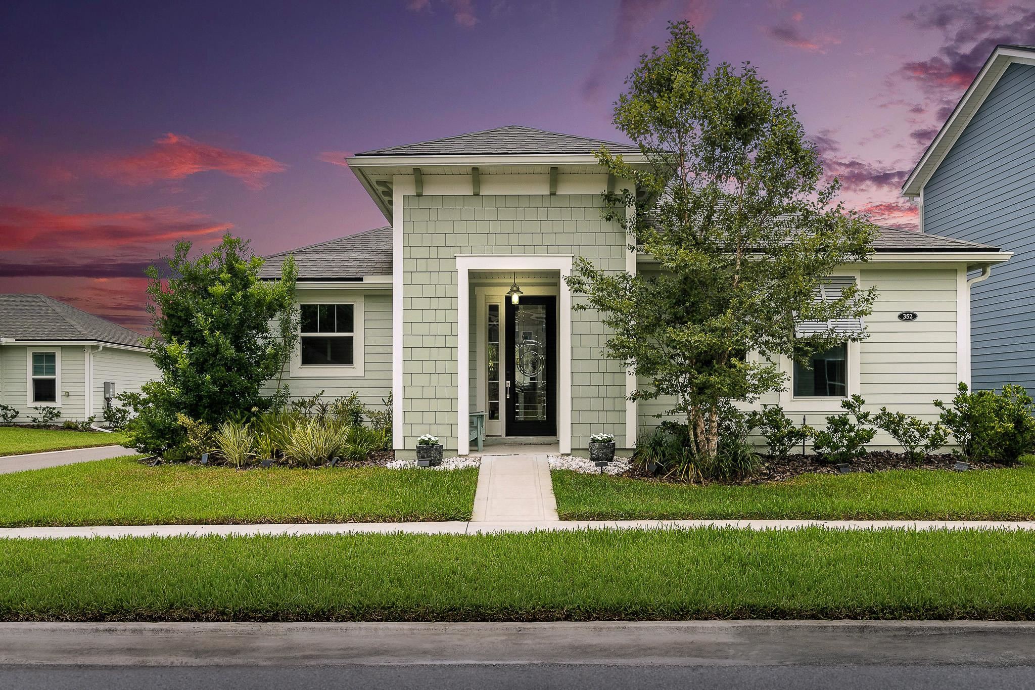 352 Footbridge Road St. Johns, FL 32259 - Photo 46 of 66 a front view of a house with a yard and garage