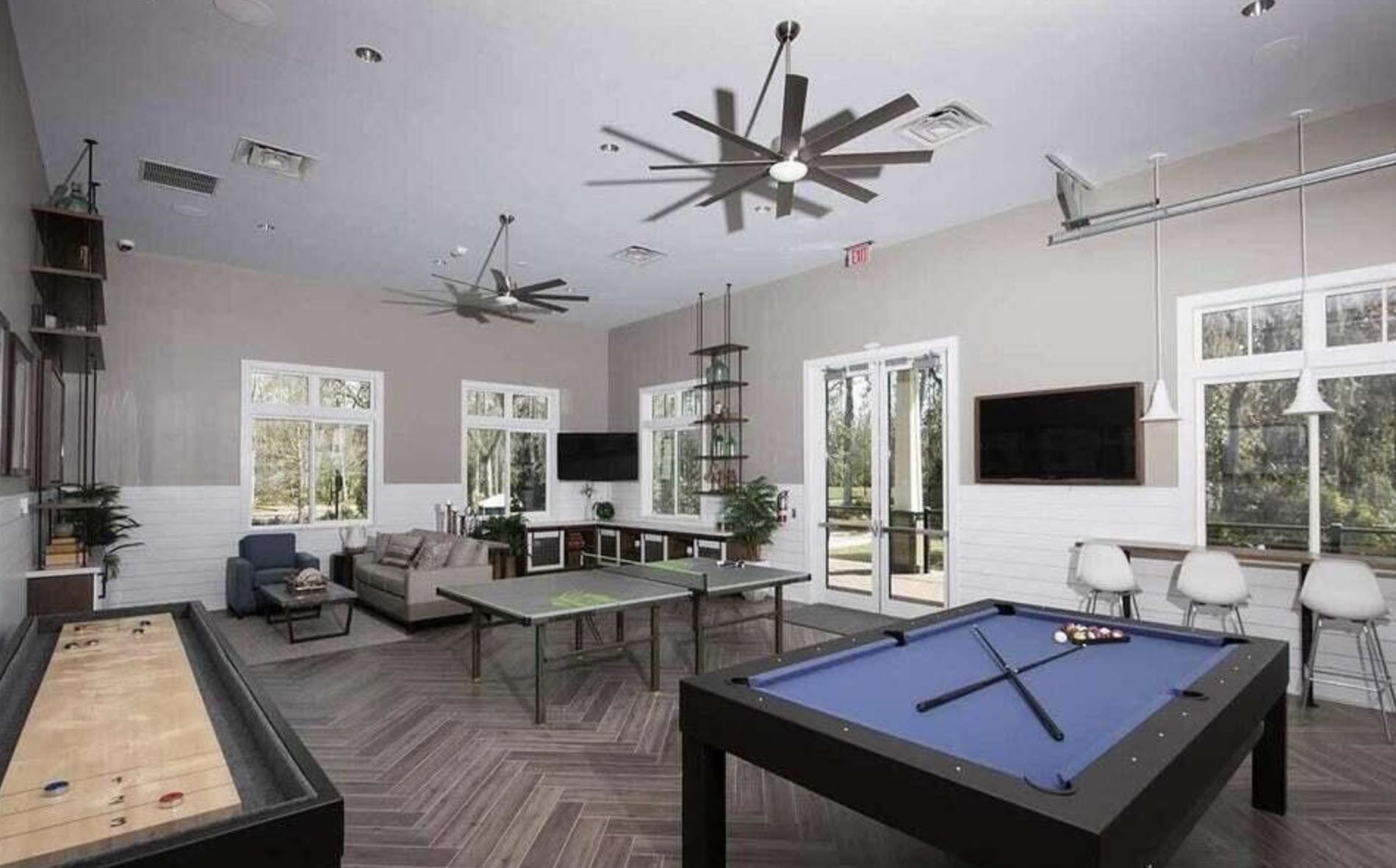 352 Footbridge Road St. Johns, FL 32259 - Photo 52 of 66 a living room with furniture a flat screen tv and a large window