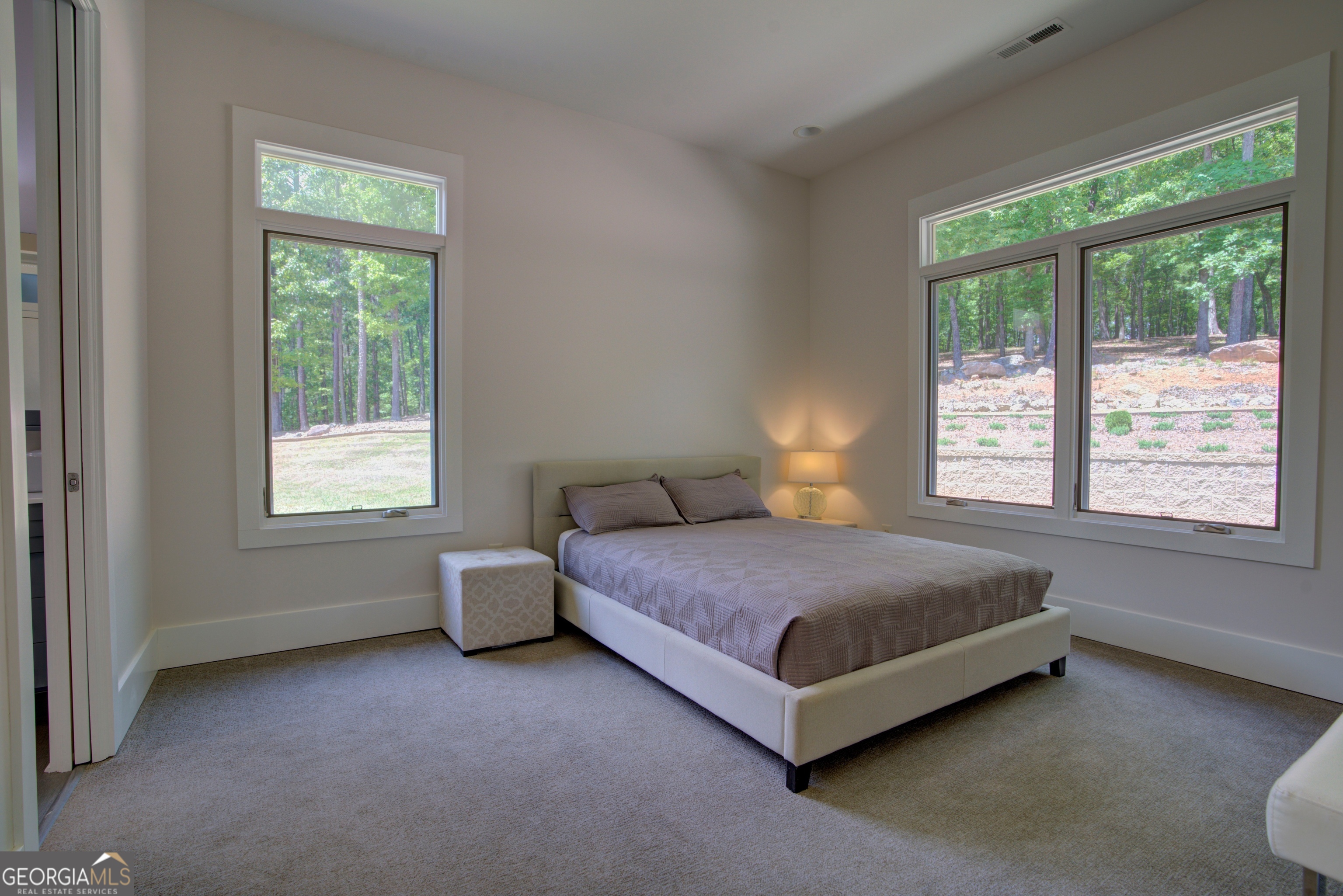 610 Kings Bridge Road Cave Spring, GA 30124 - Photo 41 of 72 a spacious bedroom with a bed and a window