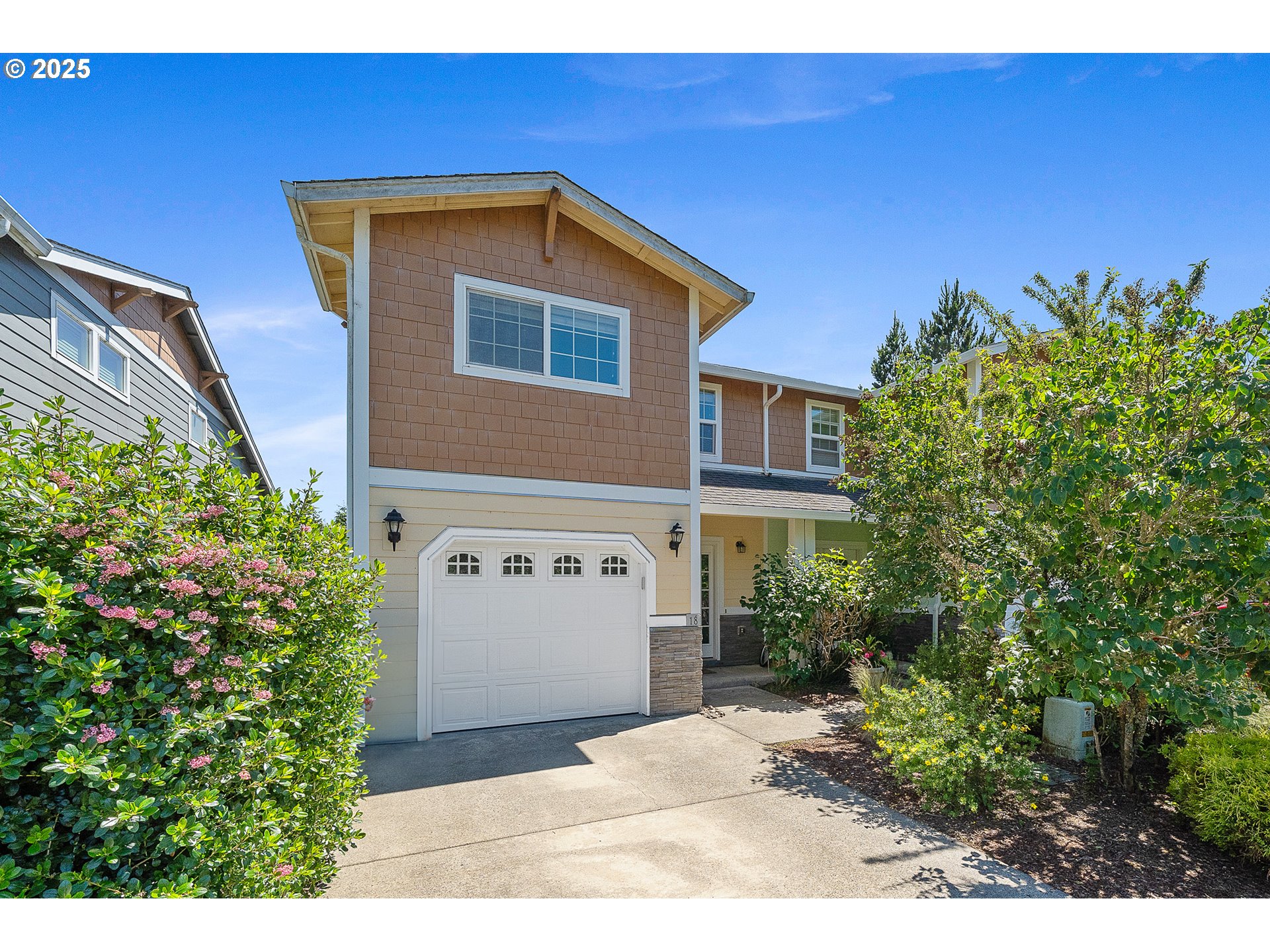13150 D Street Nehalem, OR 97131 - Photo 2 of 42 a front view of a house with a yard