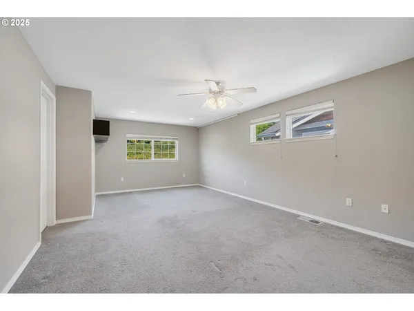 a view of an empty room with a window