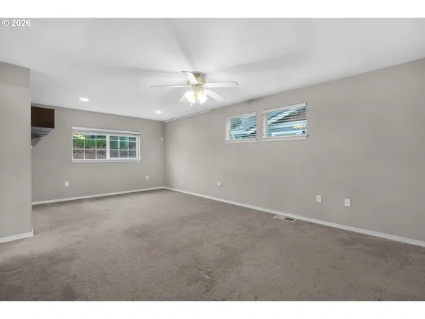 a view of an empty room with a window
