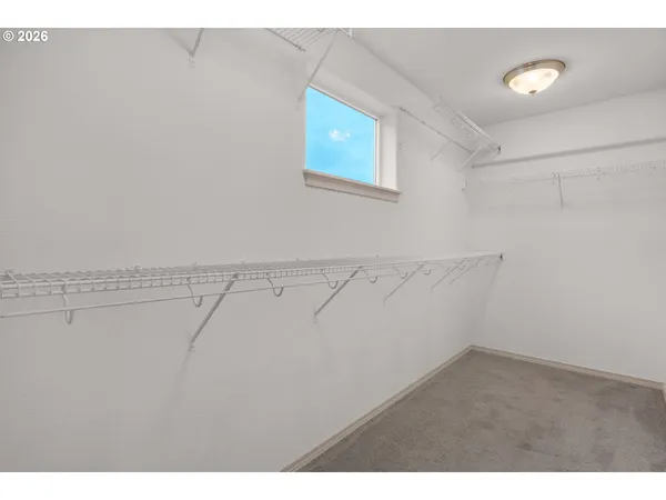 a kitchen with granite countertop a sink cabinets and window