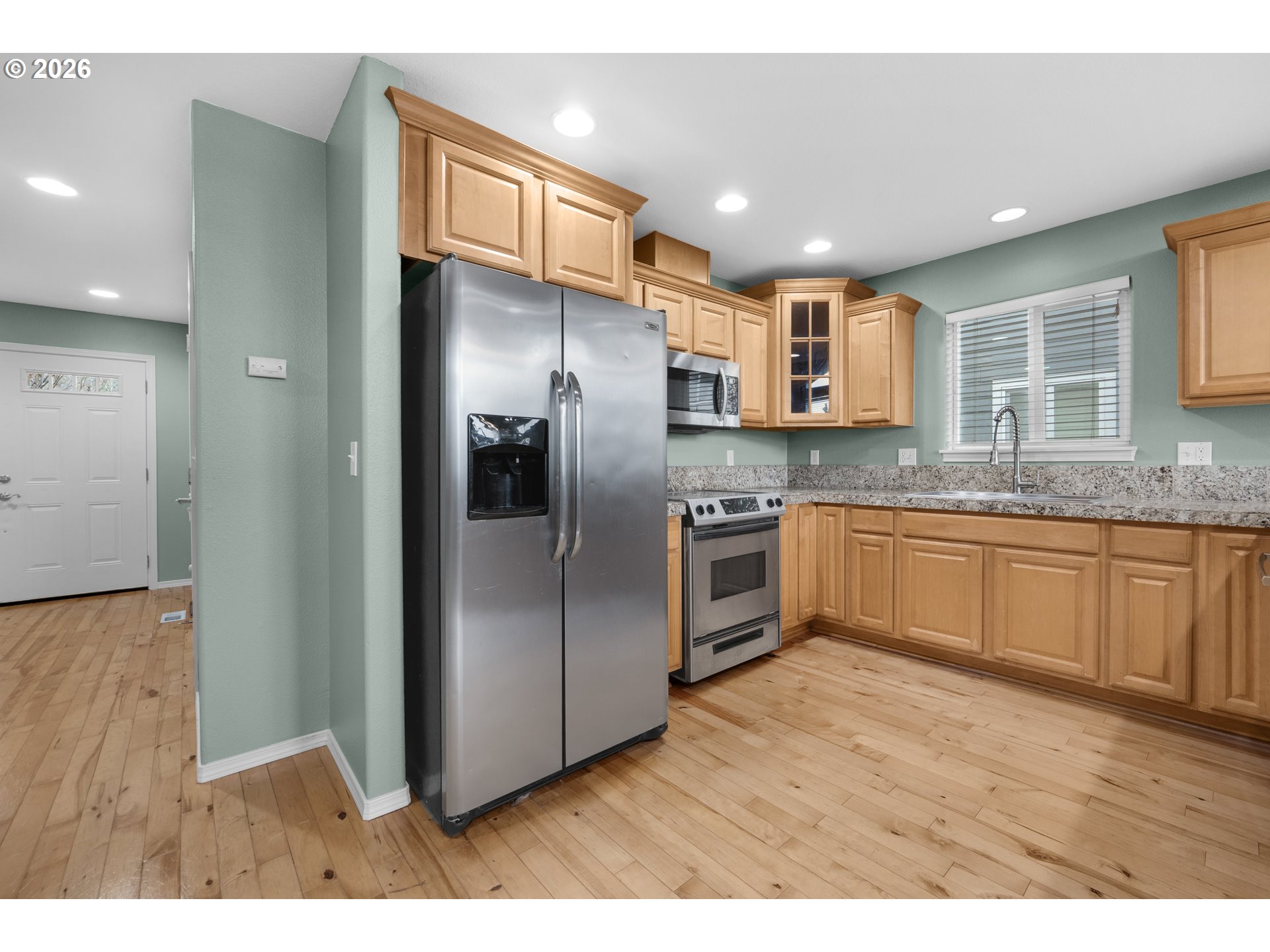 13150 D Street Nehalem, OR 97131 - Photo 42 of 42 a kitchen with stainless steel appliances granite countertop a refrigerator a sink a stove and oven