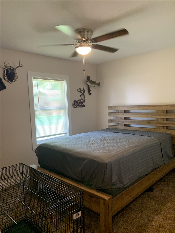 506 Ridge Street Mount Carroll, IL 61053 - Photo 11 of 17 a bedroom with a bed and a window