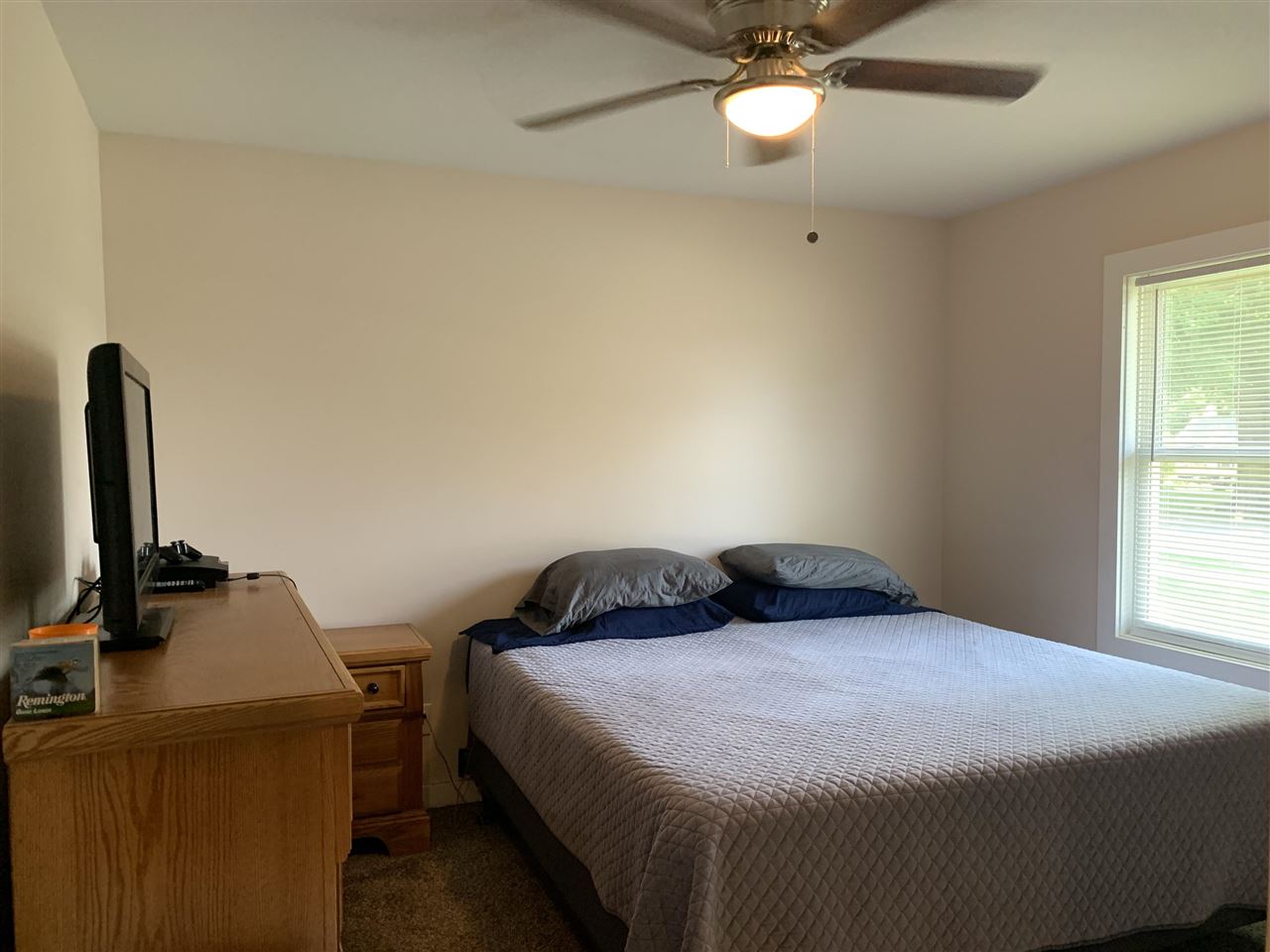 506 Ridge Street Mount Carroll, IL 61053 - Photo 13 of 17 a bedroom with a bed and a desk