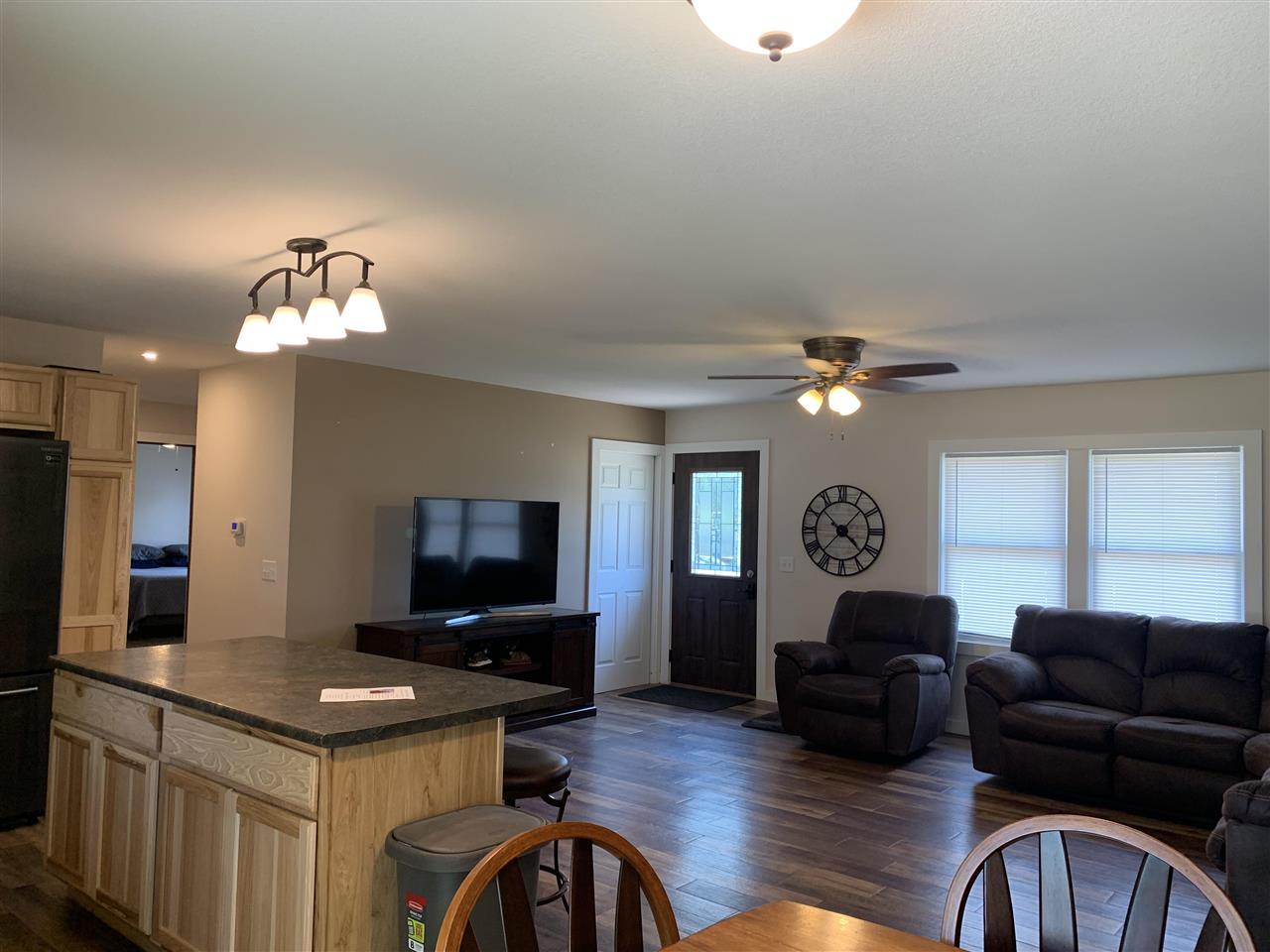 506 Ridge Street Mount Carroll, IL 61053 - Photo 3 of 17 a living room with furniture and a flat screen tv