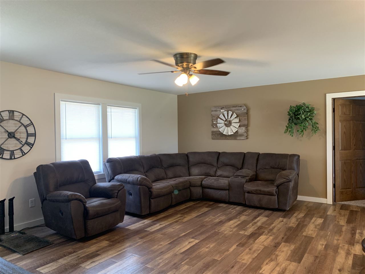 506 Ridge Street Mount Carroll, IL 61053 - Photo 4 of 17 a living room with furniture a ceiling fan and a window