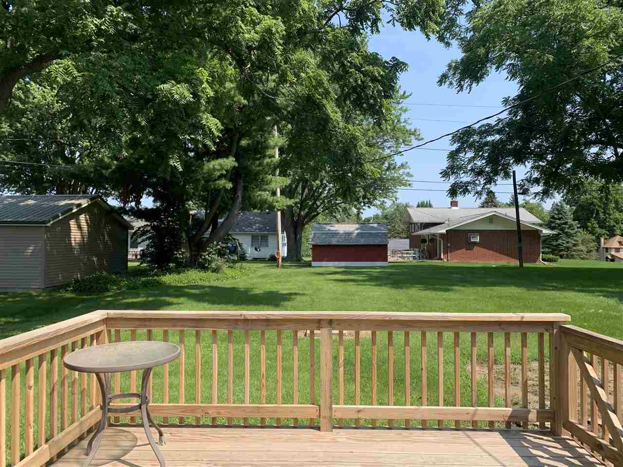 506 Ridge Street Mount Carroll, IL 61053 - Photo 6 of 17 a view of a deck with a yard