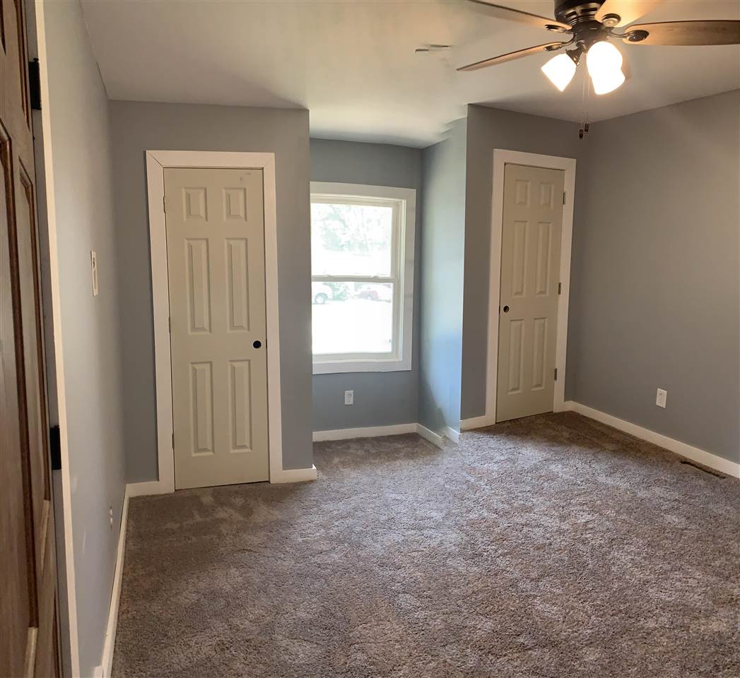 506 Ridge Street Mount Carroll, IL 61053 - Photo 7 of 17 an empty room with windows and fan