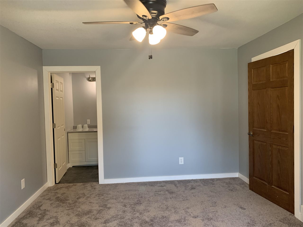 506 Ridge Street Mount Carroll, IL 61053 - Photo 8 of 17 an empty room with closet and a chandelier fan