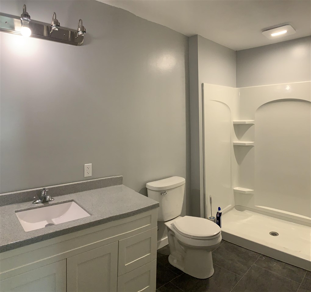 506 Ridge Street Mount Carroll, IL 61053 - Photo 10 of 17 a bathroom with a sink a toilet and shower