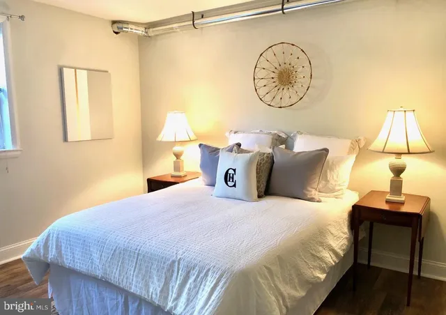 a bedroom with a bed and a table