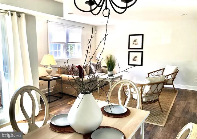 a dining room with furniture and wooden floor