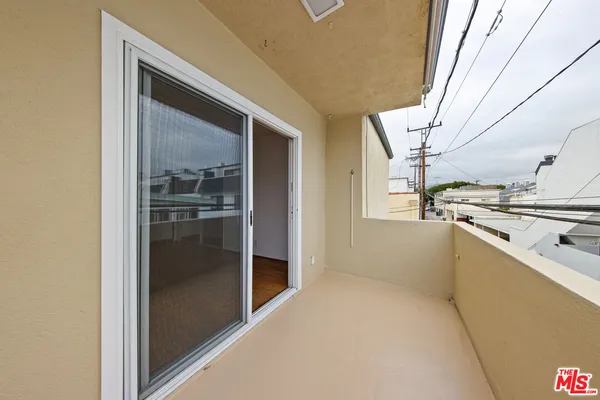 a kitchen with stainless steel appliances kitchen island a refrigerator and a sink