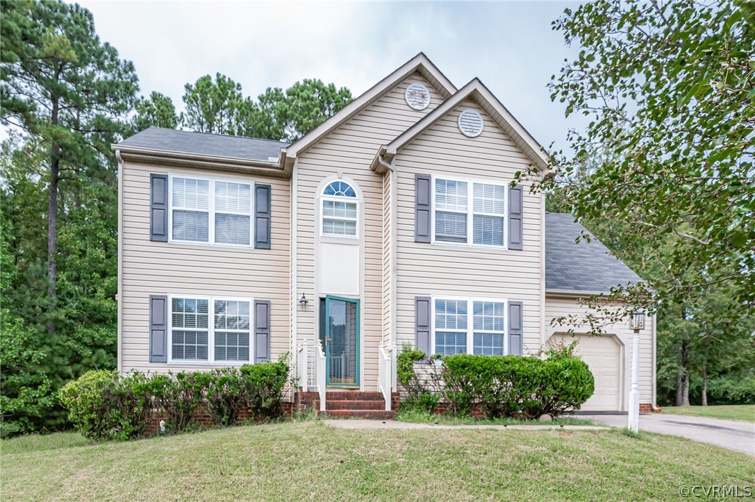 264 Scotch Pine Drive Sandston, VA 23150 - Photo 1 of 26 a front view of a house with a yard