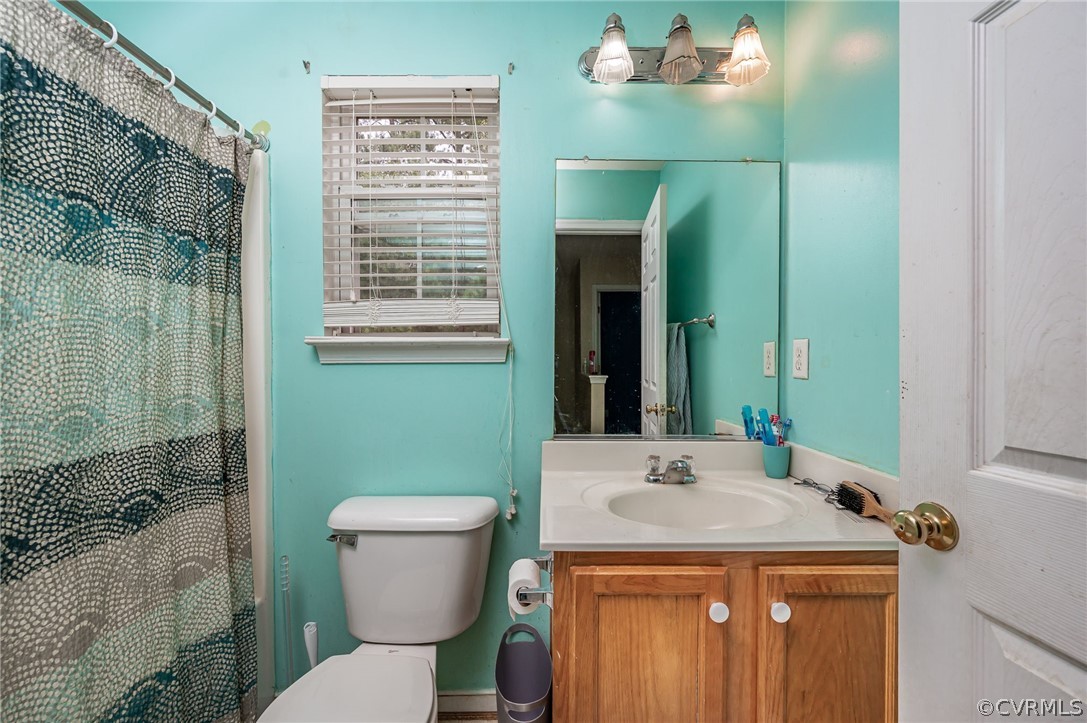 264 Scotch Pine Drive Sandston, VA 23150 - Photo 21 of 26 a bathroom with a sink a toilet and shower