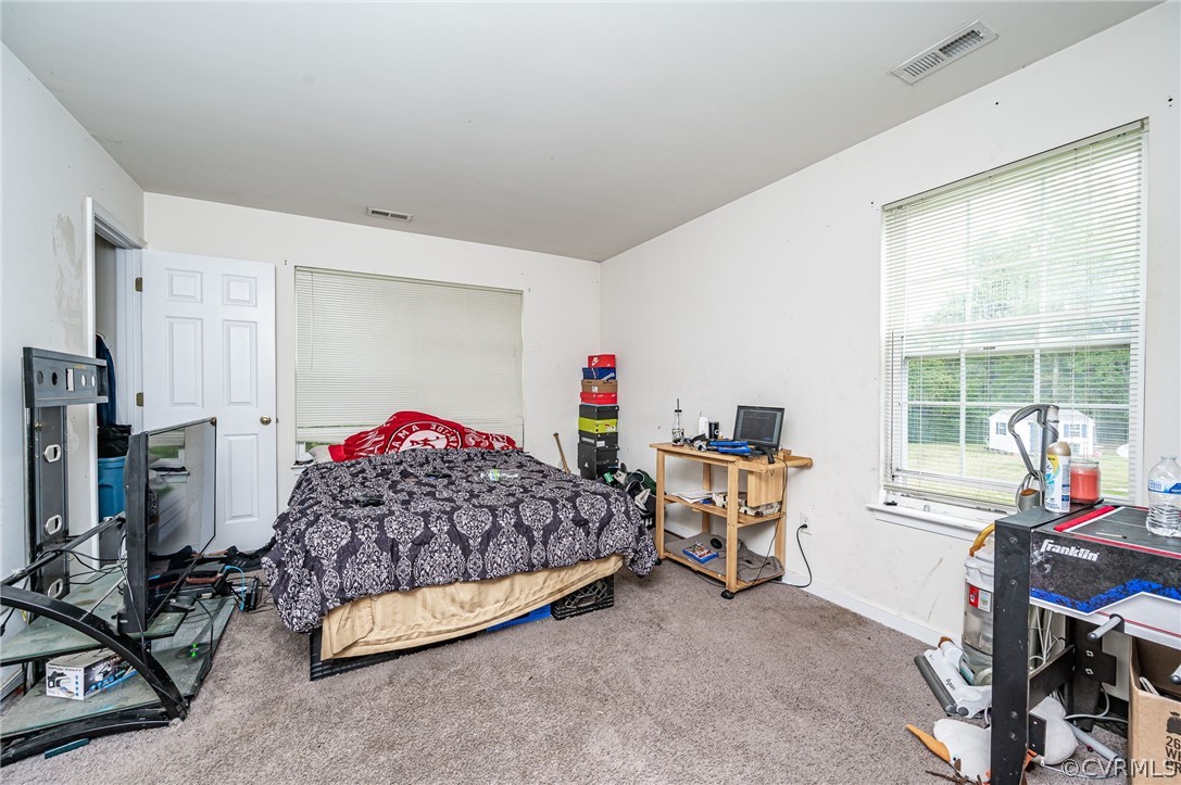 264 Scotch Pine Drive Sandston, VA 23150 - Photo 24 of 26 a bed room with a bed window and a chair