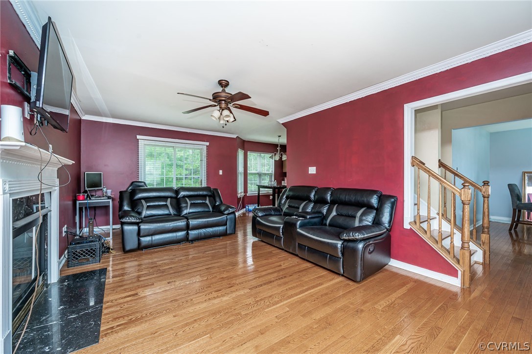 264 Scotch Pine Drive Sandston, VA 23150 - Photo 7 of 26 a living room with furniture a fireplace and a flat screen tv