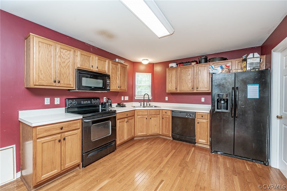 264 Scotch Pine Drive Sandston, VA 23150 - Photo 9 of 26 a kitchen with a sink stove and refrigerator
