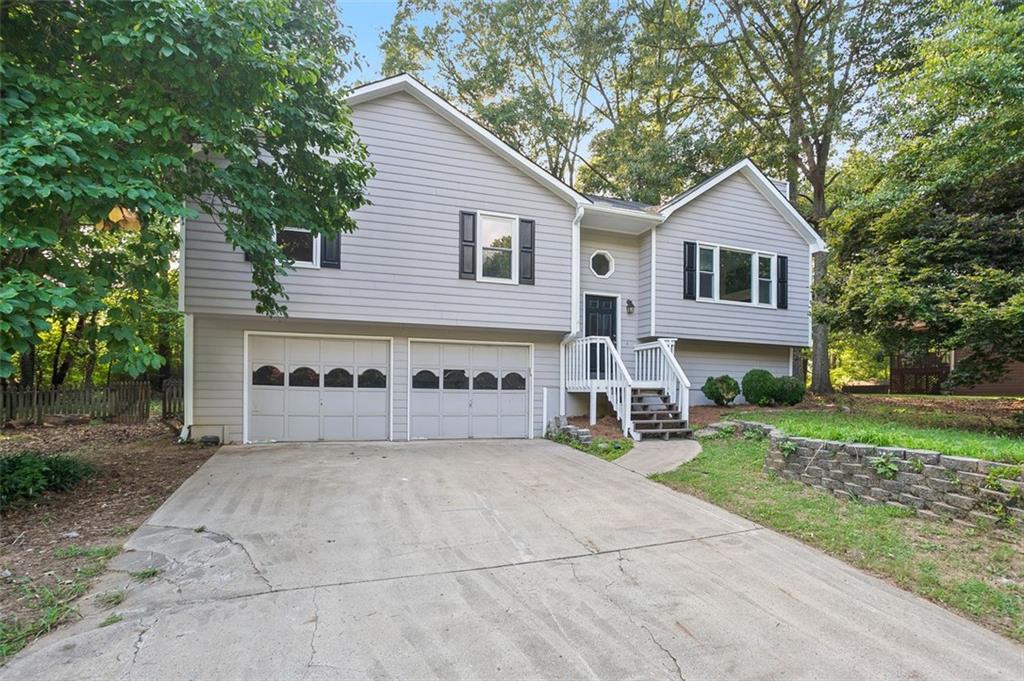 50 Ridge Run Drive Hiram, GA 30141 - Photo 1 of 1 a view of a house with a yard and large tree