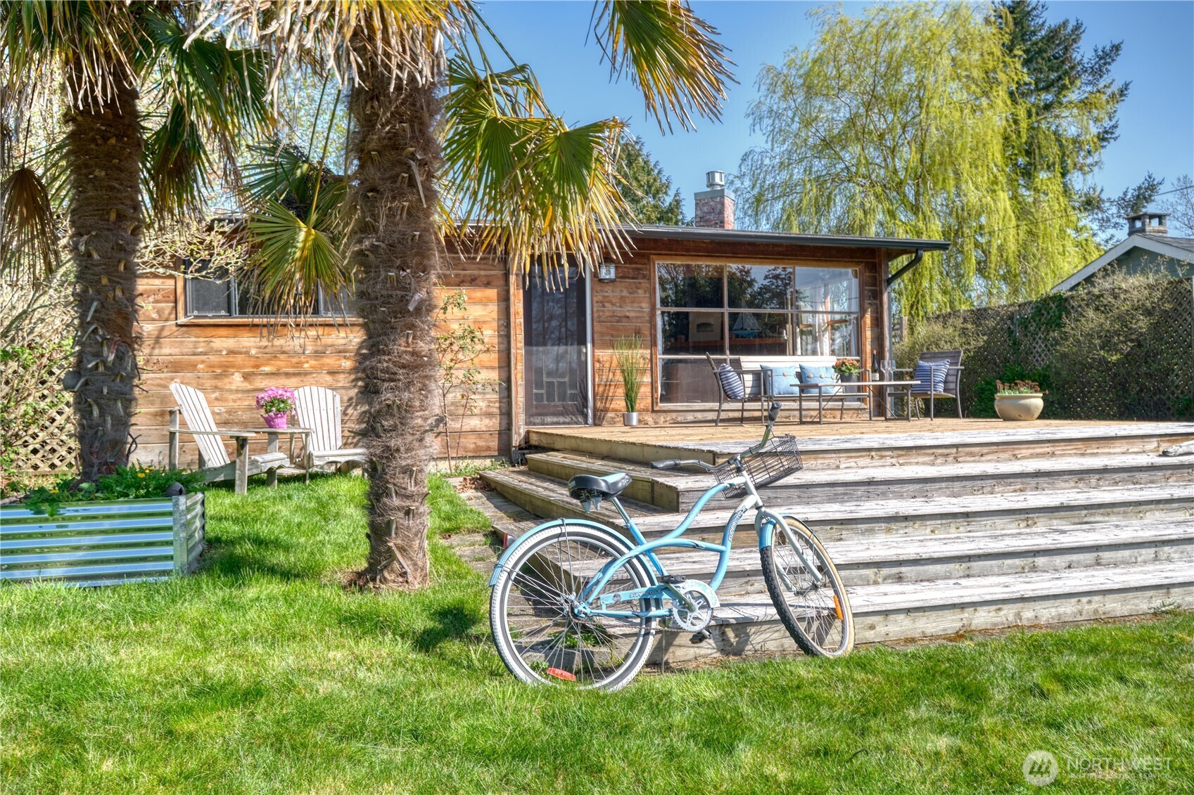 a bike parked in front of a house with a small yard