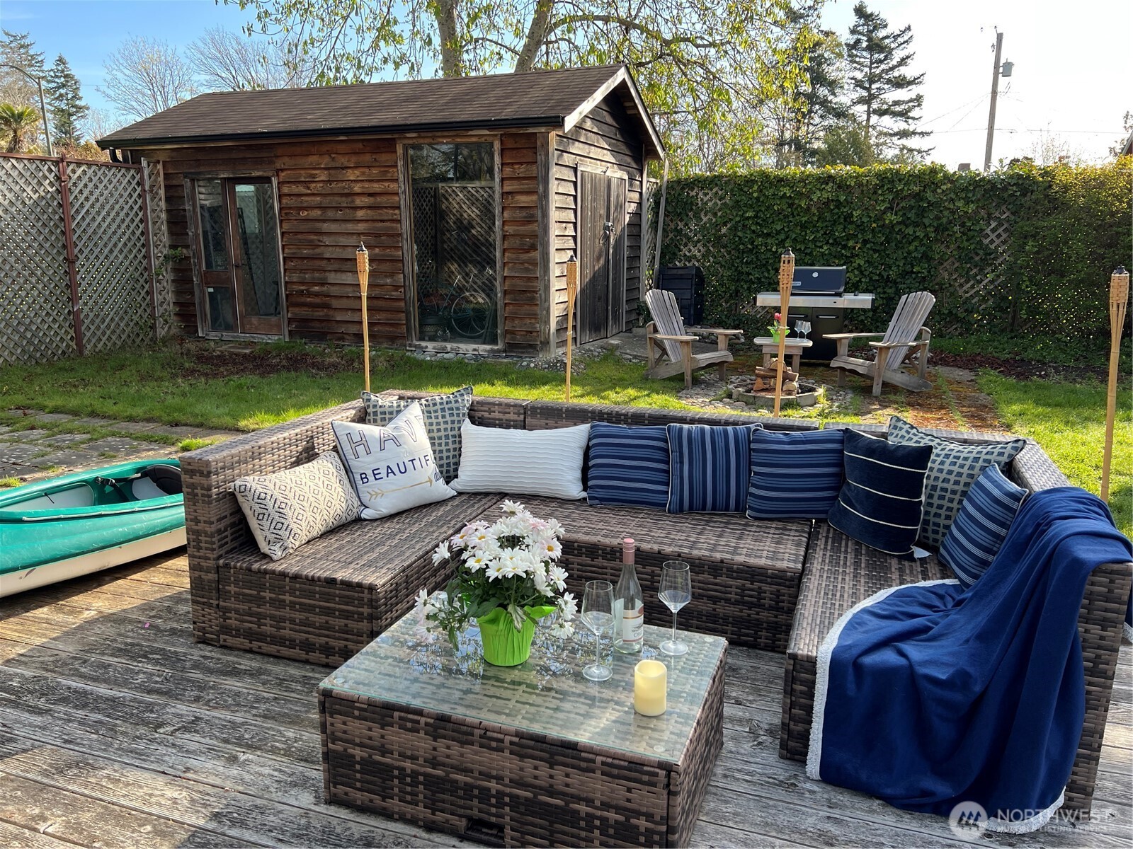 684 Mallard Drive Point Roberts, WA 98281 - Photo 18 of 37 a view of a patio with couches chairs and swimming pool with a yard