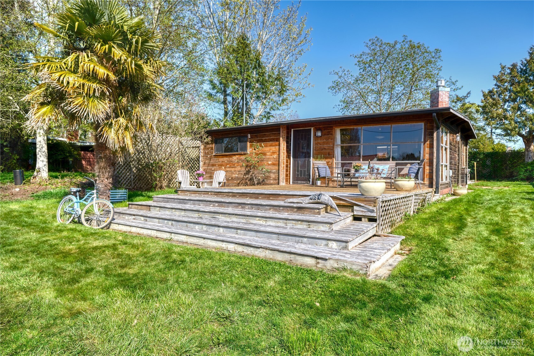 684 Mallard Drive Point Roberts, WA 98281 - Photo 2 of 37 a view of a house with backyard and sitting area