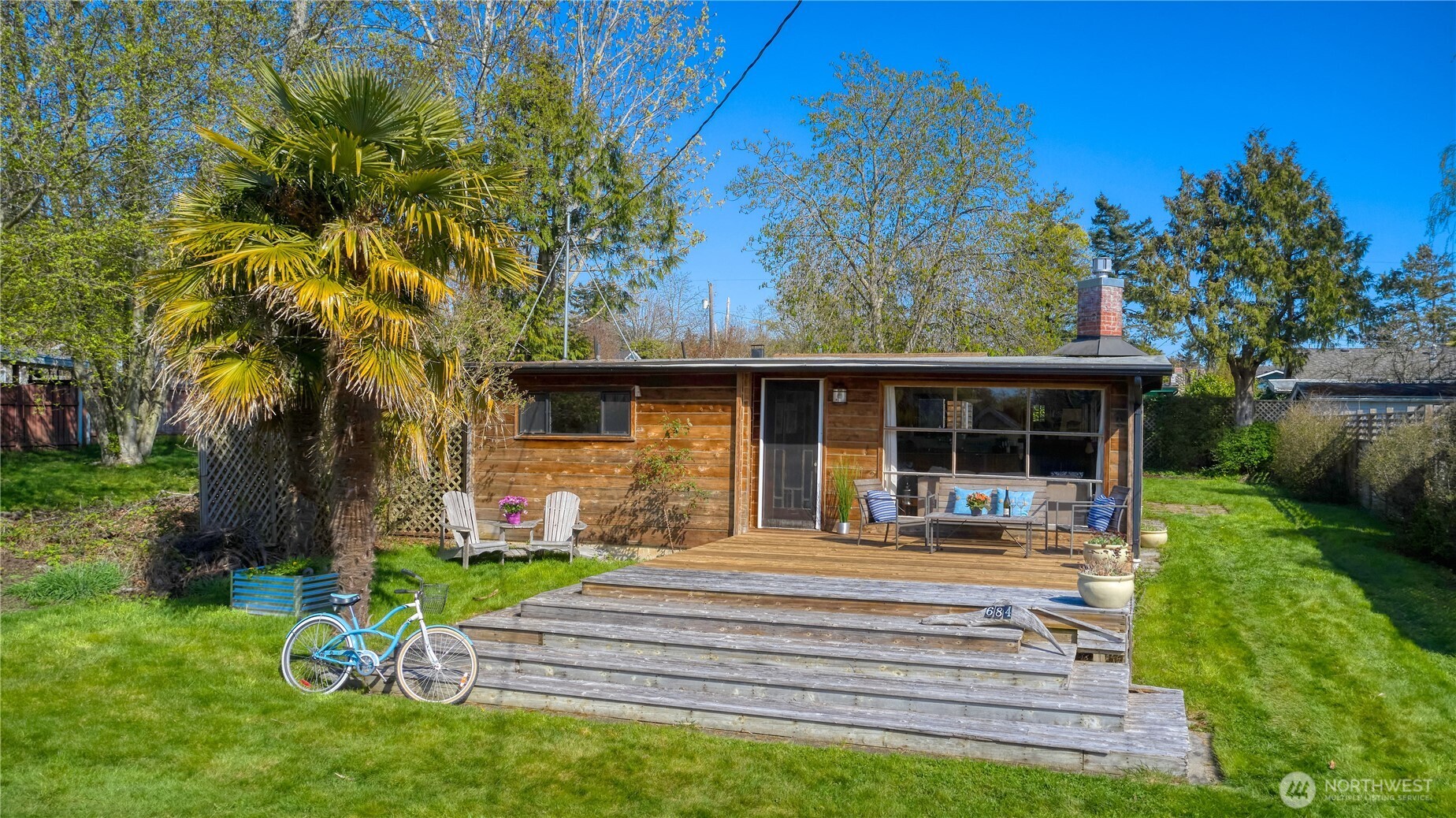 684 Mallard Drive Point Roberts, WA 98281 - Photo 31 of 37 a front view of a house with garden and trees