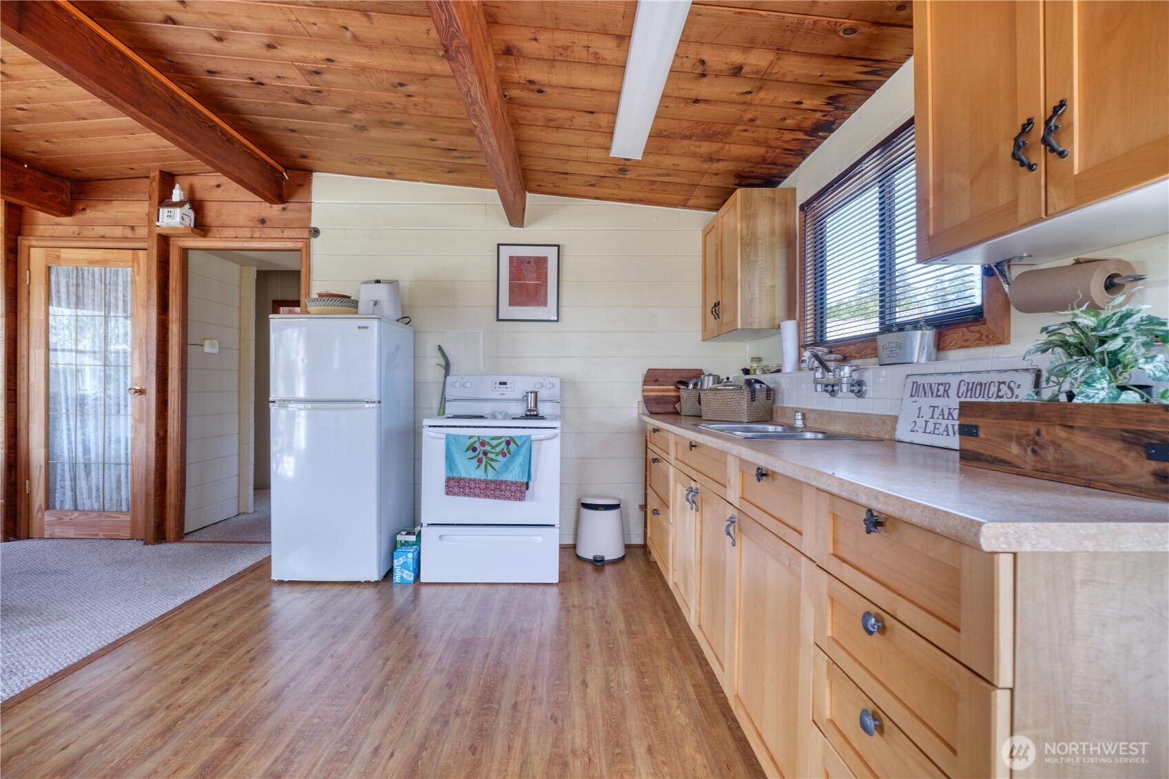 684 Mallard Drive Point Roberts, WA 98281 - Photo 9 of 37 a kitchen with stainless steel appliances a refrigerator and a sink