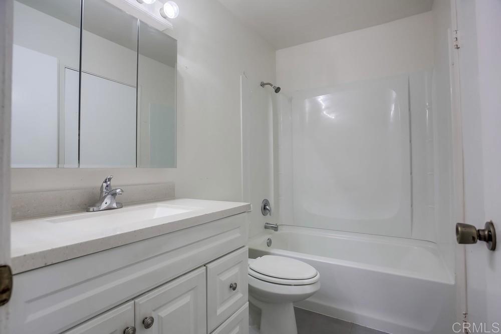 3538 Sandpiper Place Oceanside, CA 92056 - Photo 11 of 16 a bathroom with a sink a toilet and a bathtub