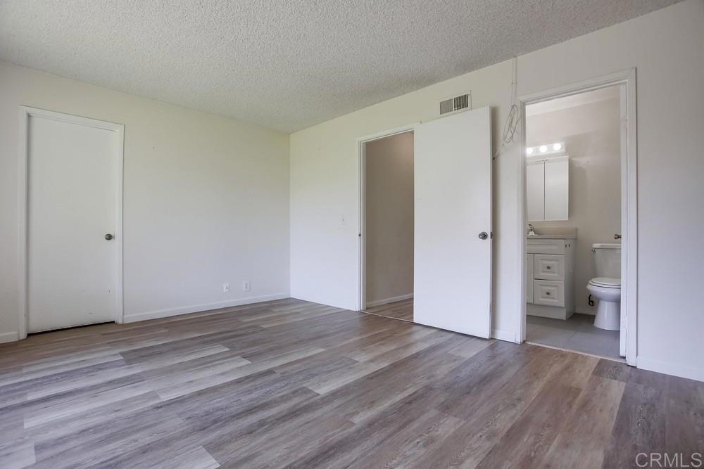 3538 Sandpiper Place Oceanside, CA 92056 - Photo 12 of 16 a view of an empty room and wooden floor