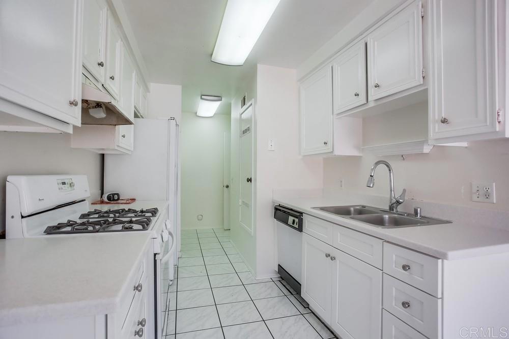 3538 Sandpiper Place Oceanside, CA 92056 - Photo 7 of 16 a kitchen with cabinets and appliances