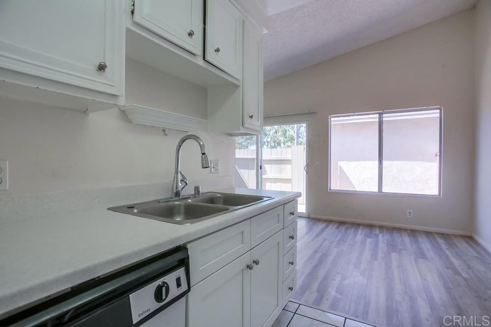 3538 Sandpiper Place Oceanside, CA 92056 - Photo 8 of 16 a kitchen with a sink and wooden floor