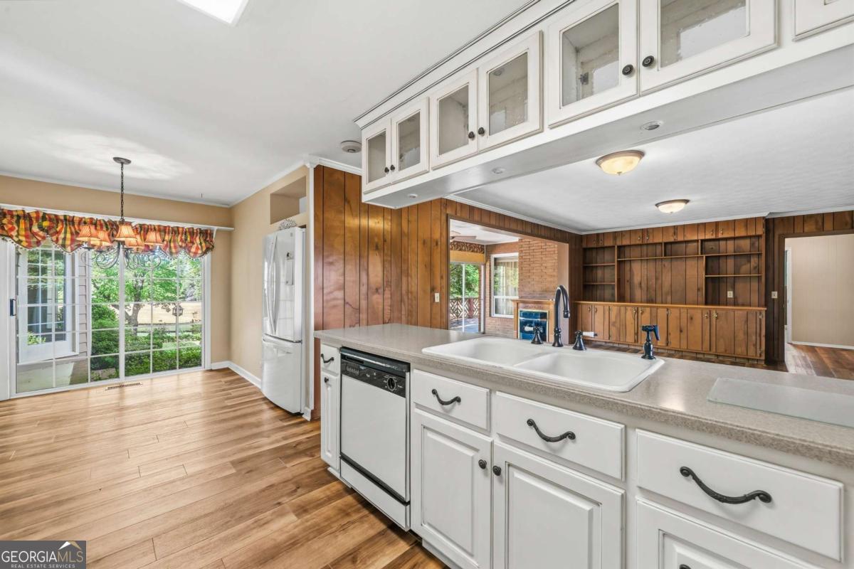 56 Claymont Road McIntyre, GA 31054 - Photo 22 of 63 a open kitchen with stainless steel appliances granite countertop a stove and a wooden floors
