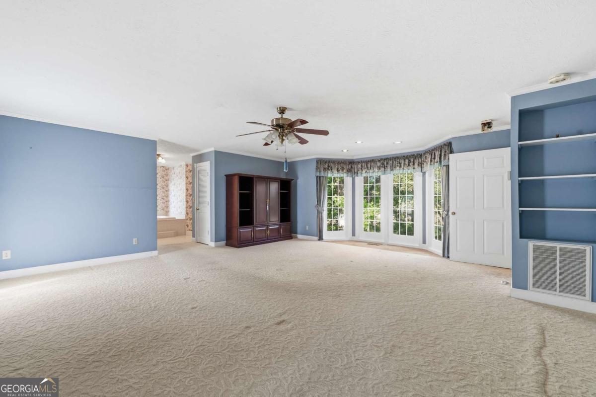 56 Claymont Road McIntyre, GA 31054 - Photo 27 of 63 a view of a livingroom with an empty space and a fireplace