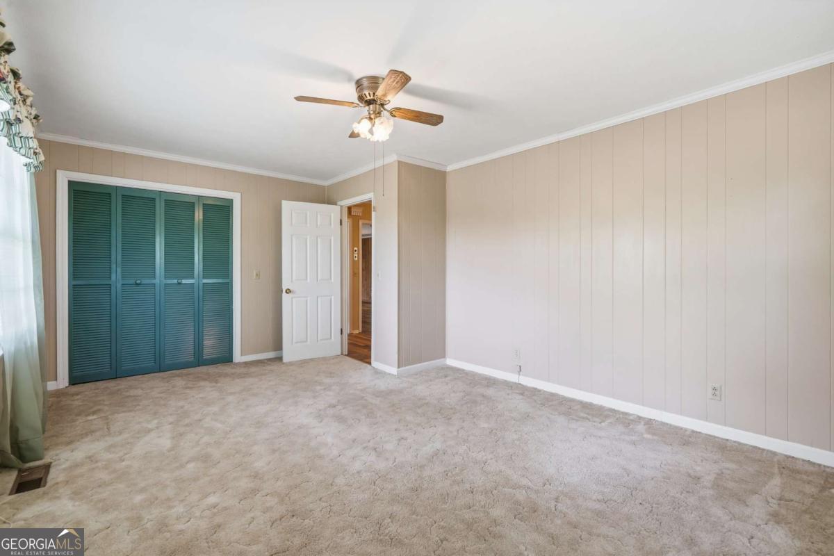 56 Claymont Road McIntyre, GA 31054 - Photo 35 of 63 a view of an empty room with a fan