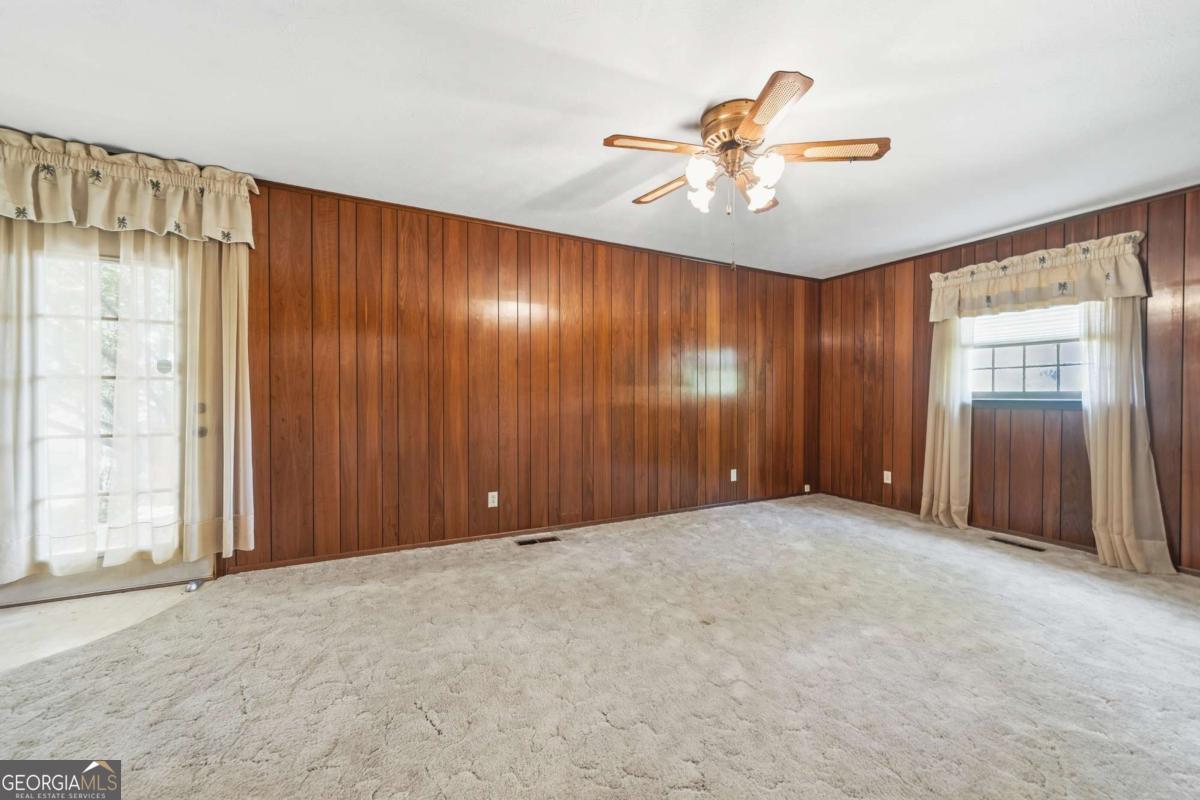 56 Claymont Road McIntyre, GA 31054 - Photo 38 of 63 an empty room with fan and windows
