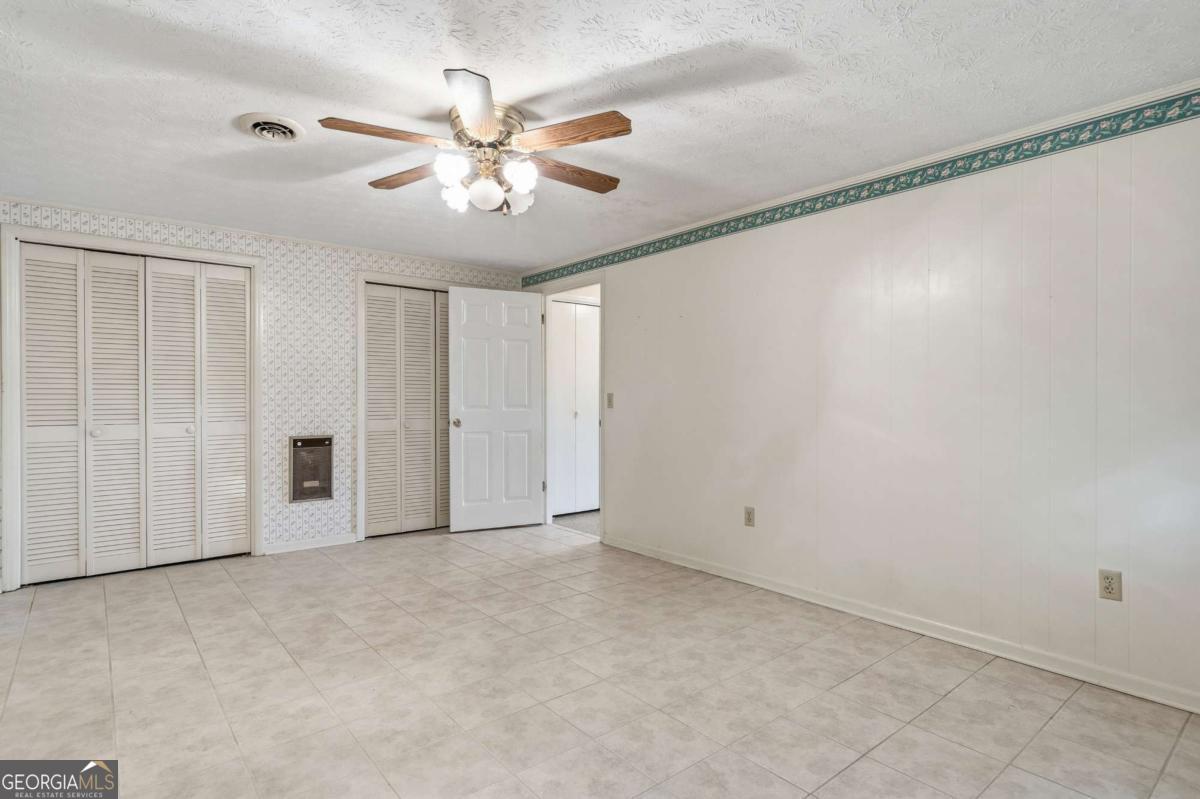 56 Claymont Road McIntyre, GA 31054 - Photo 4 of 63 a view of an empty room