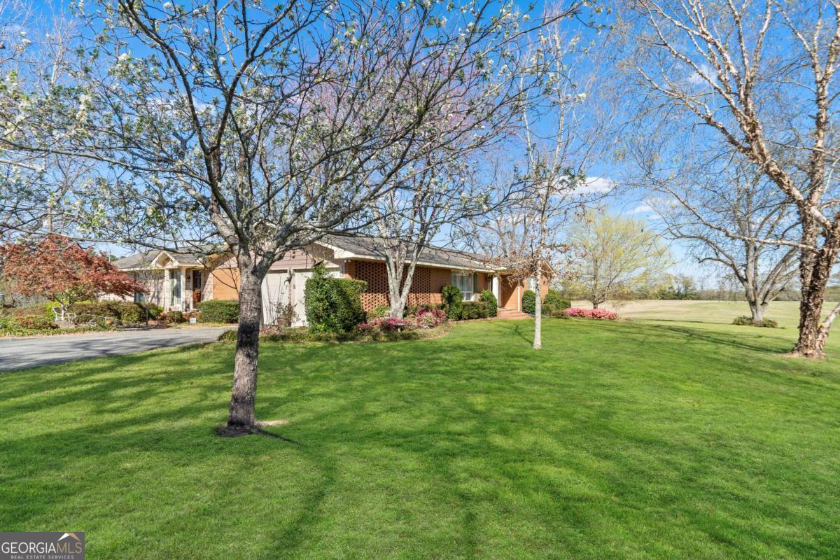 56 Claymont Road McIntyre, GA 31054 - Photo 46 of 63 a view of a house with a yard