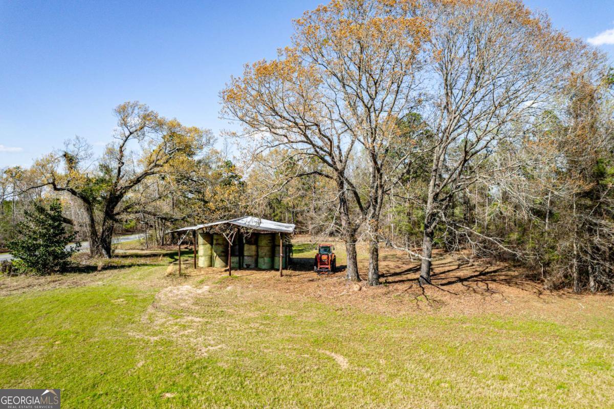 56 Claymont Road McIntyre, GA 31054 - Photo 63 of 63 a view of a swimming pool with an outdoor seating