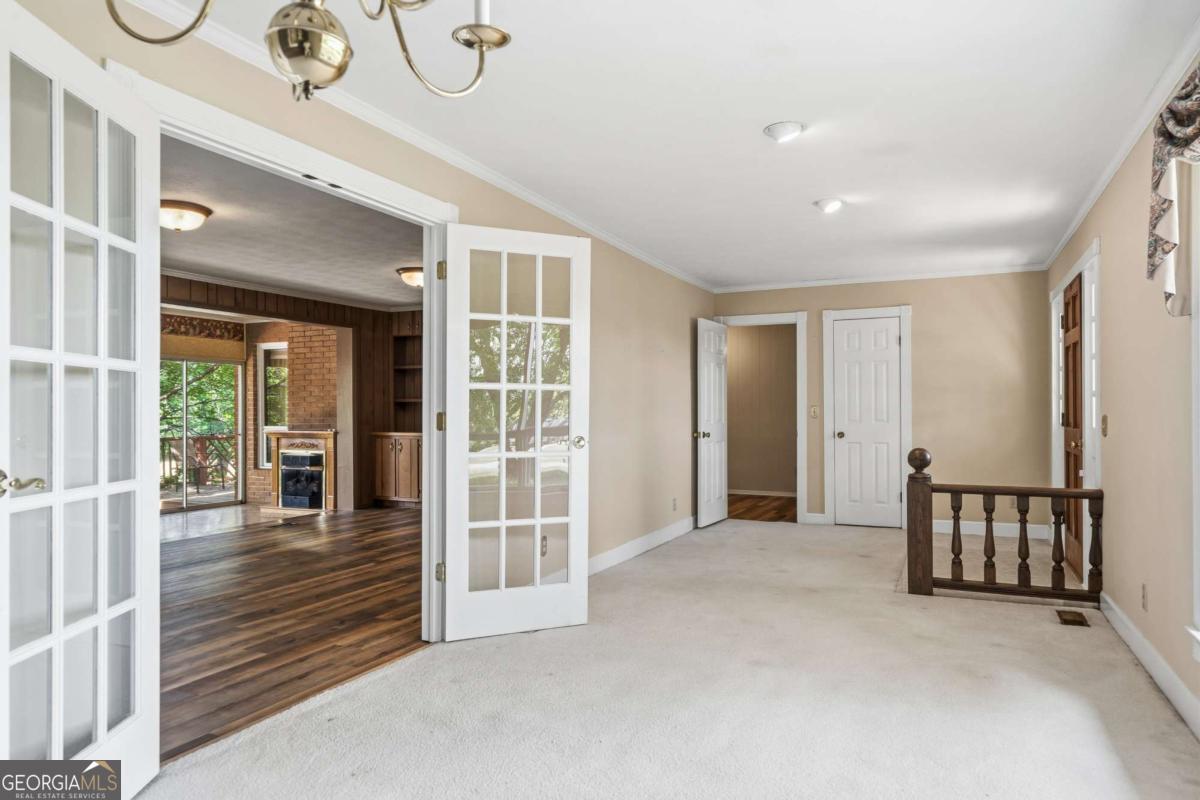56 Claymont Road McIntyre, GA 31054 - Photo 10 of 63 a view of a hallway with wooden floor and door