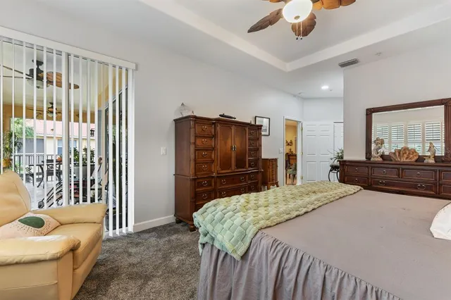 a bathroom with a granite countertop sink a mirror and shower