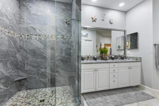 a bedroom with a bed and a potted plant